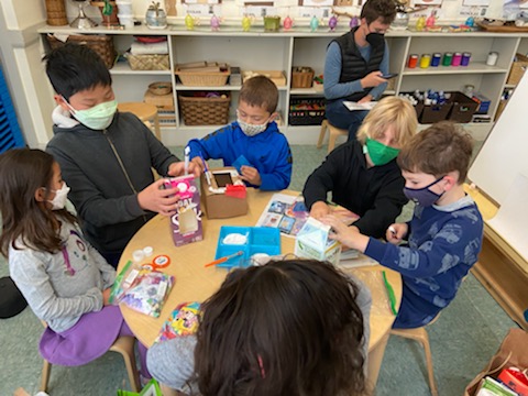 Spotlight on EBI IB Middle School 2 students around a tabel