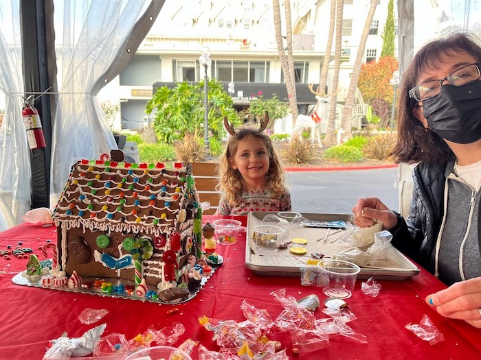 gingerbread house child and adult