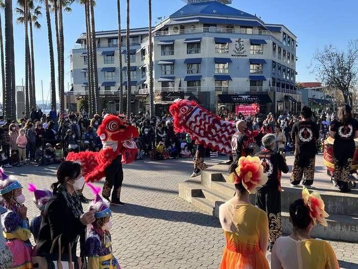 Crowd watches Lion Dance at Lunar New Year event.