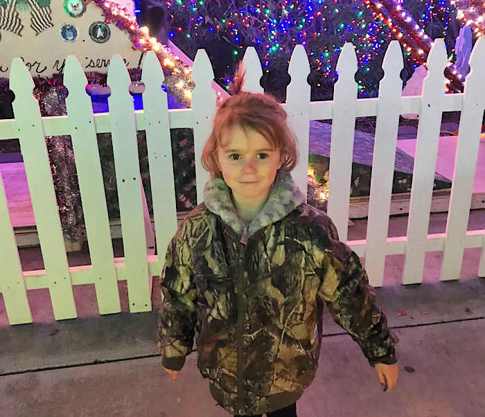 child in front of christmas lights in Livermore