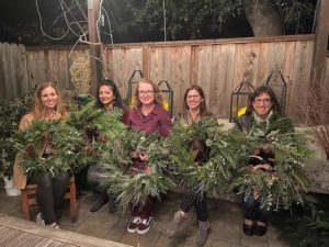 5 ladies holding wreaths