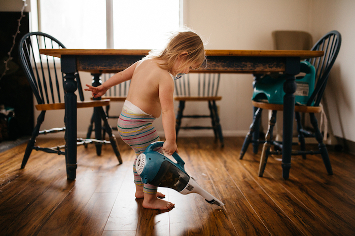 Toddler cleaning the floor