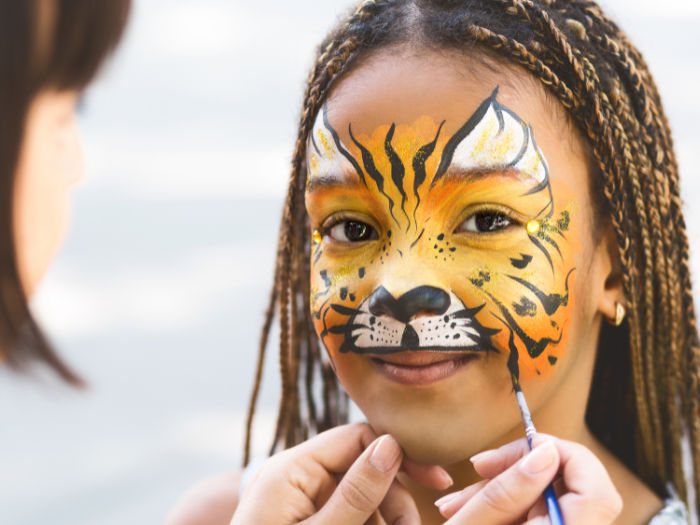 girl getting face painted
