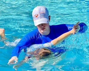 adult and child swimming