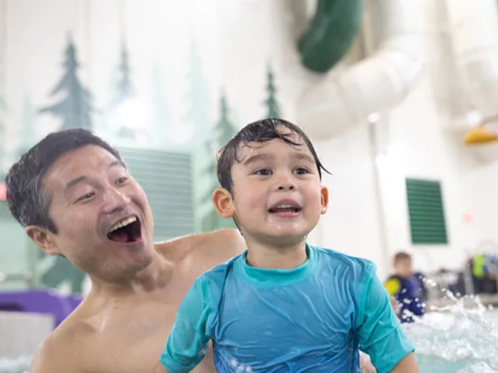 parent and child in indoor swim area