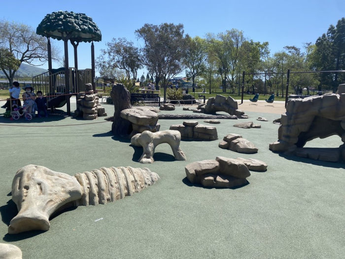 sabercat playground has a mastodon climbing bones
