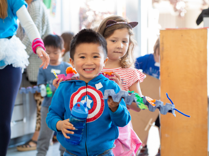 Win a Confidence-Boosting Week of In-Person Camp EDMO 1 young children hold crafty creations