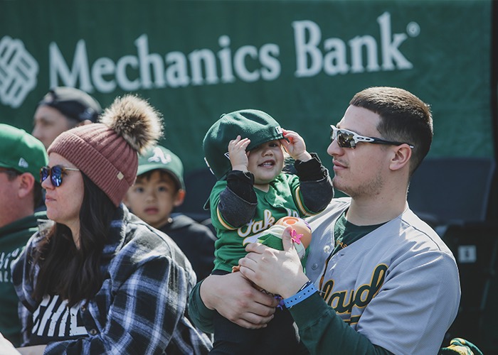 young fans and parents at an Oakland A's game