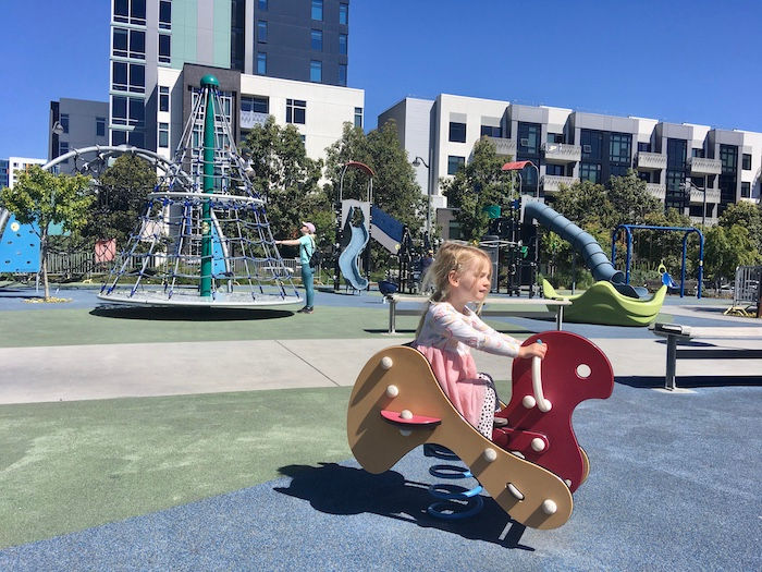 What to Do With Kids Around San Francisco's Chase Center 3 playground bouncing horsey and child