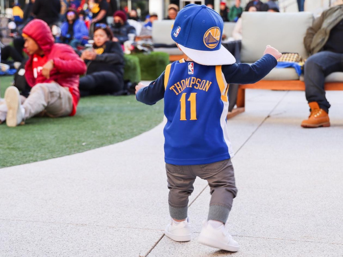 little toddler at thrive city in warriors jersey