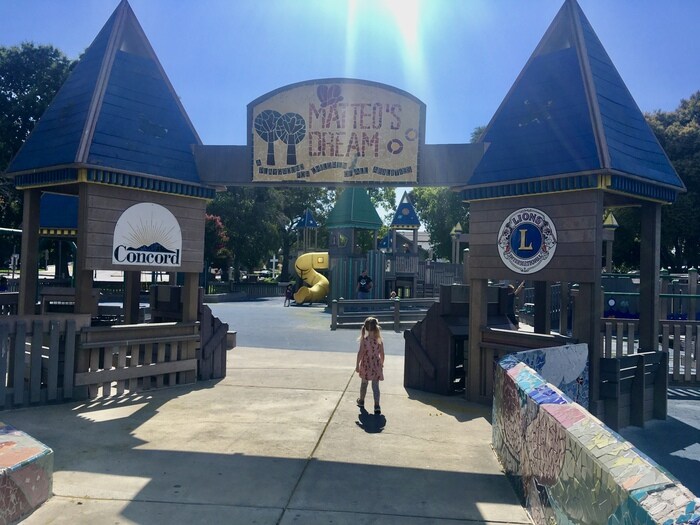 Matteo's Dream Playground, Inclusive Fun in Concord 1 Child walks under park welcome sign at all abilities playground