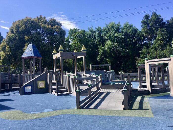 Wide wheelchair-accessable ramp at play structure for all ability