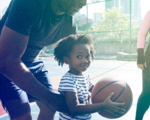 basketball little girl and dad on the outdoor courts