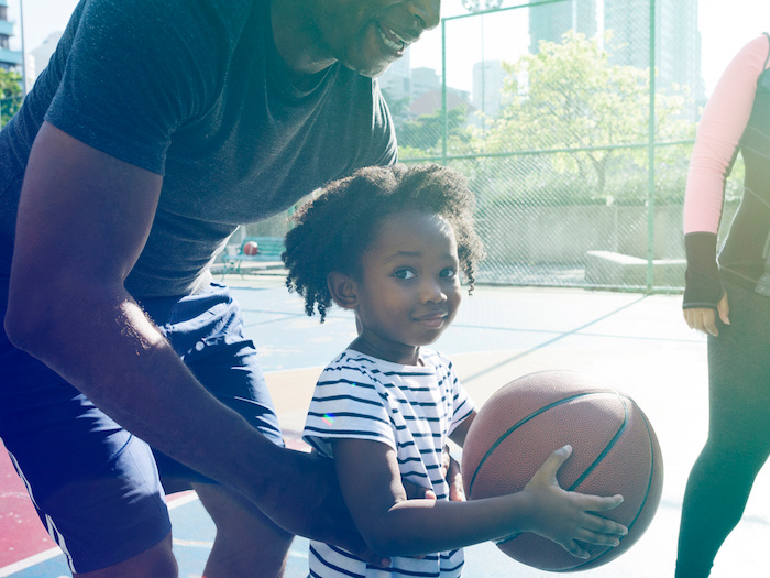 basketball little girl and dad on the outdoor courts
