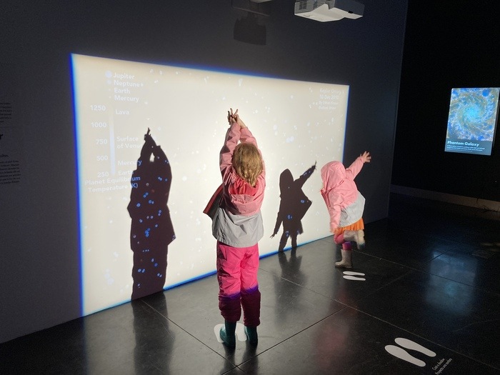 kids making shapes with shadows