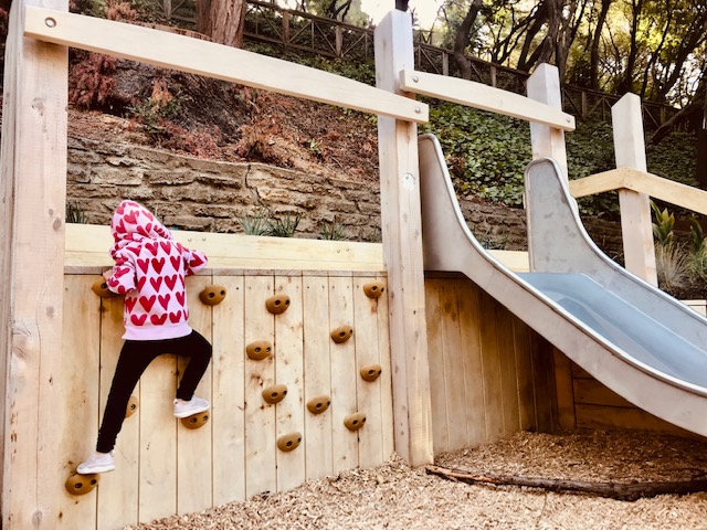 child climbing wall
