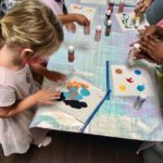 Child makes sensory art
