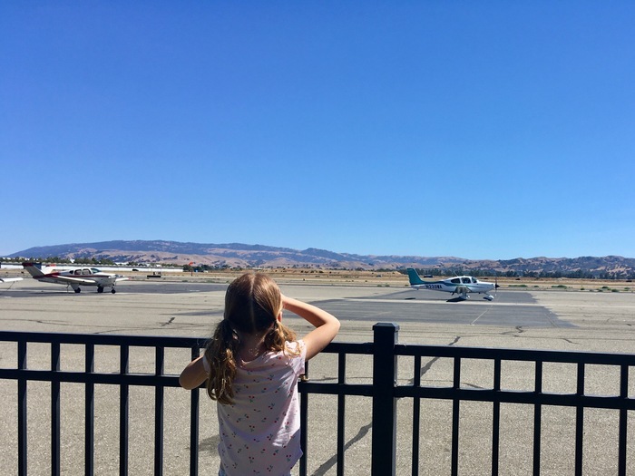 Child watches plane at Livermore Airport