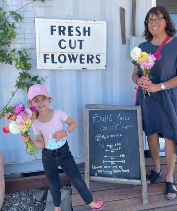 fresh cut flowers, girl, woman and bouquets with pricing
