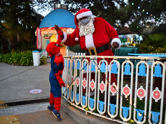 black santa gives high five