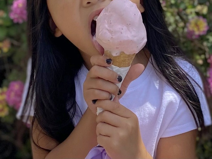 Kid eating ice cream cone from Loard's Ice Cream in San Leandro