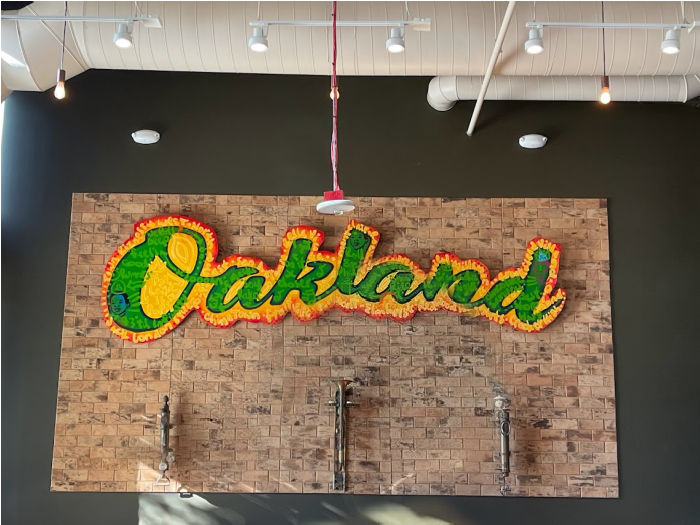 oakland sign above the bar at Chop