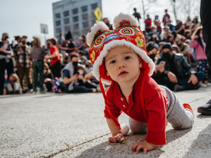 Baby wears dragon hat for Lunar New Year