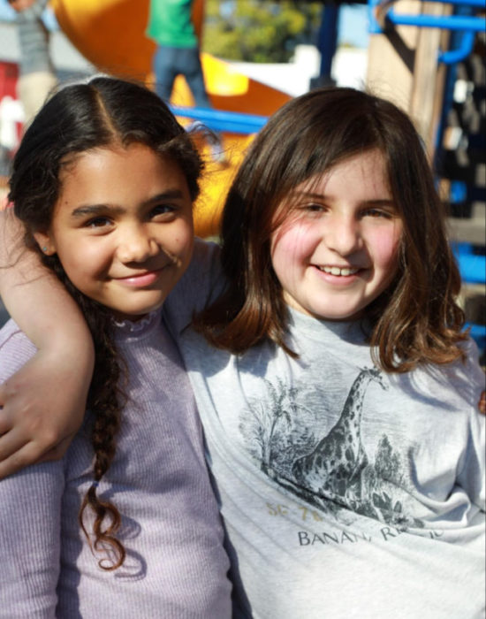 Spotlight on Ecole Bilingue de Berkeley (EB) 3 two kids embrace