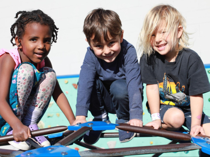 Spotlight on Ecole Bilingue de Berkeley (EB) 2 three children on a play structure