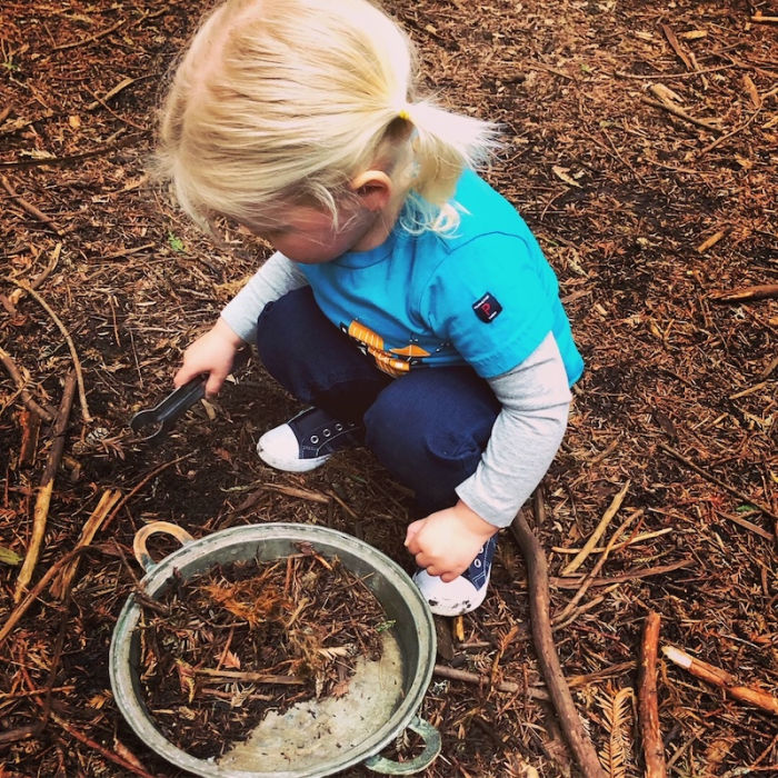 Nature-Based Playgroups and Classes in the East Bay 1 little girl playing in dirt gathering items from nature