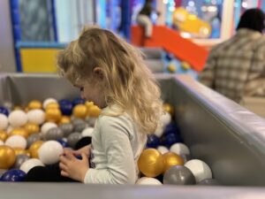 kid in ball pit