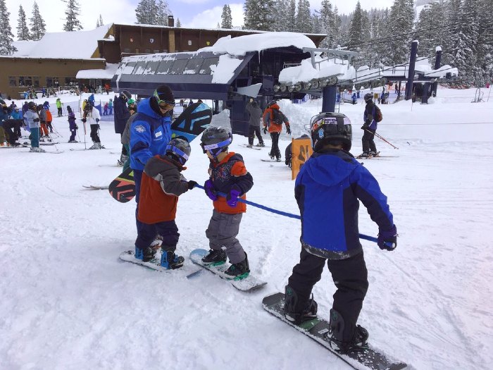 Kids on snowboards at Sugar Bowl Ski Resort in Tahoe