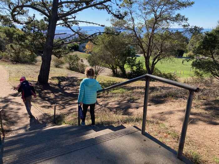 Child walks down stairs to park