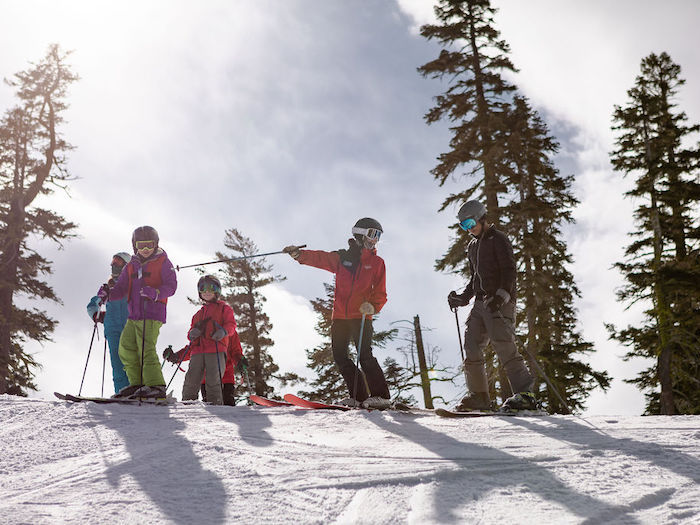 small group ski lesson of children and teens