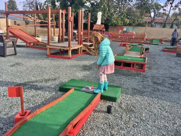 Child at mini golf
