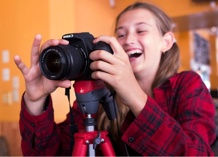 teen with a dlsr camera dslr
