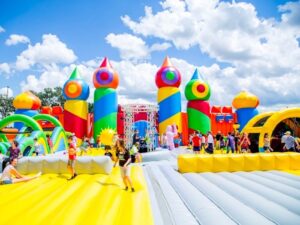 kids on a gigantic bouncy house obstacle course from big bounce america