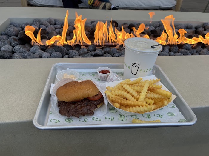 Bay Street Emeryville: A Family-Friendly Destination 1 Burger, fries, & shake by the fire pit at Bay Street Bay Break Terrace
