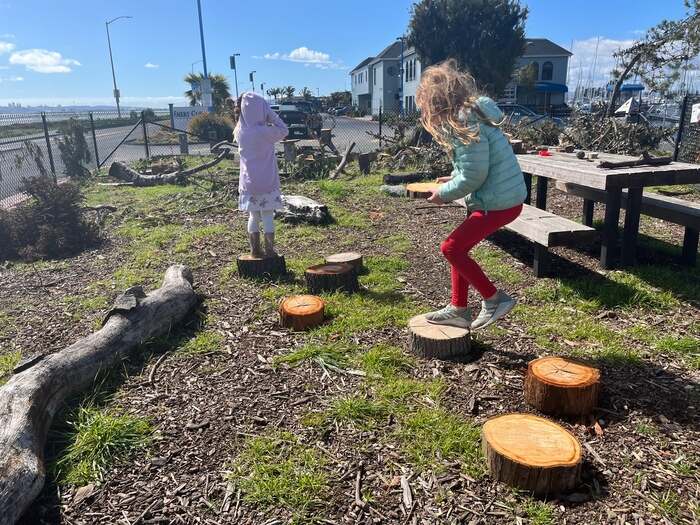 Children playing in nature area at park