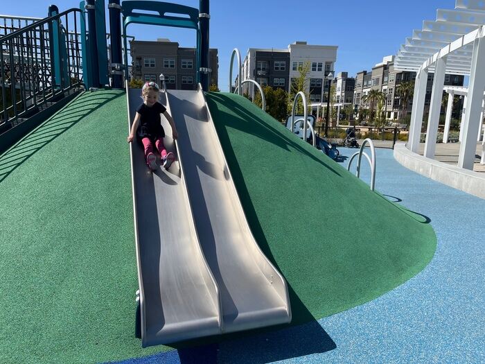 Child going down slide