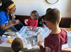 kids taking a class from a teacher at home with grasshopper kids