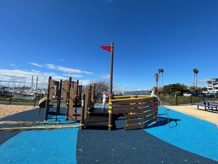 children on pirate ship themed playground