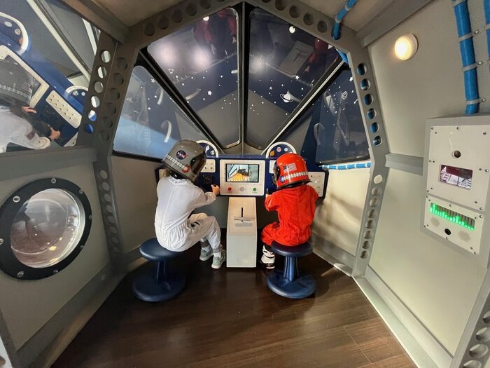 Children play in pretend spaceship