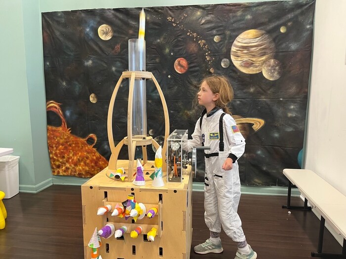 Child launches paper rocket
