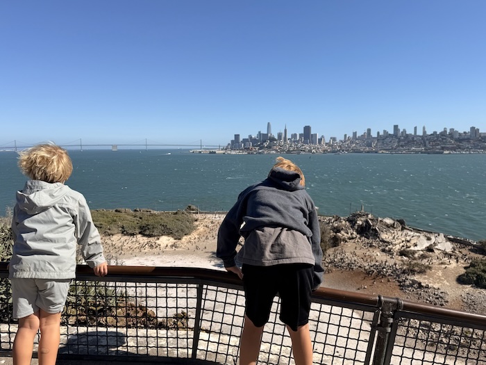 two kids looking back at San Francisco from Alcatraz island