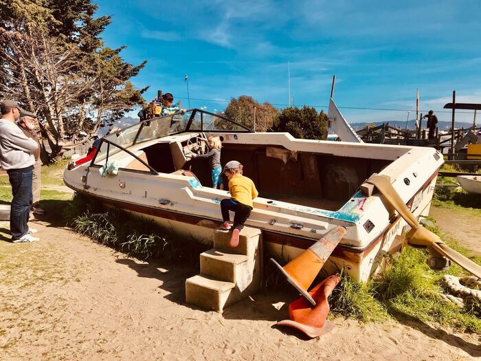 children climb on old boat at Adventure Playground in berkeley