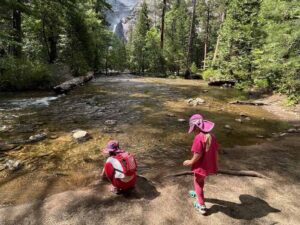 Children playing in a lake at Yosemite National Park