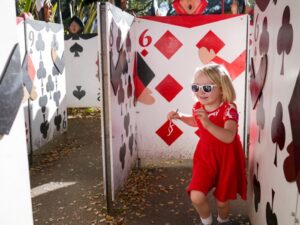 Fairyland kid running through the card maze, Oakland photo by Sally Mason