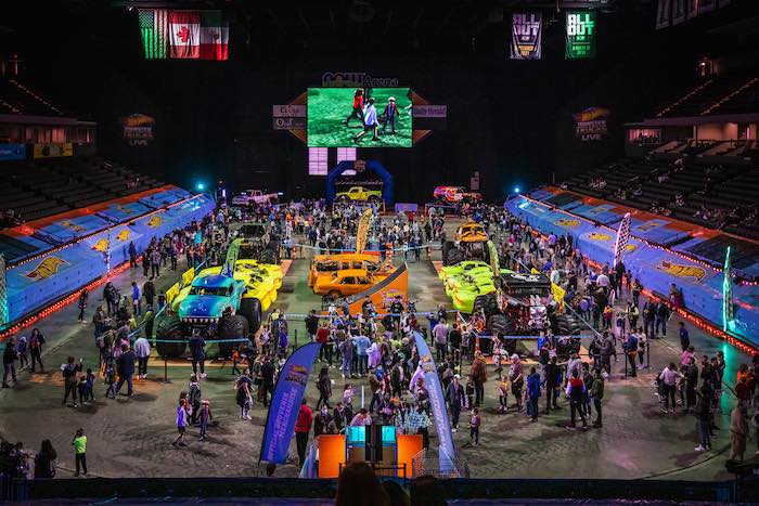 top side view of the arena floor filed with monster trucks and hot wheels fun