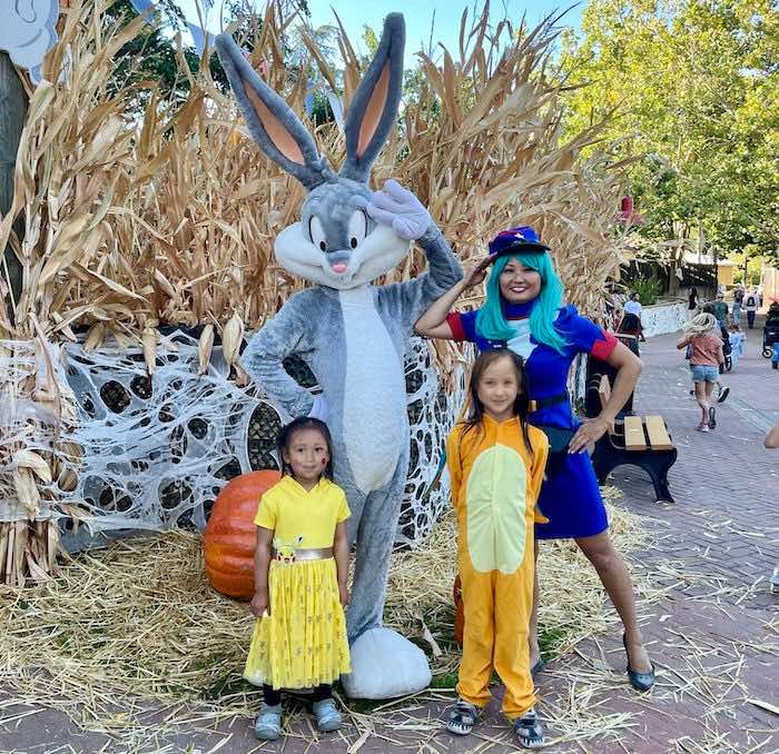 costumed mom and children at halloween six flags boo fest 